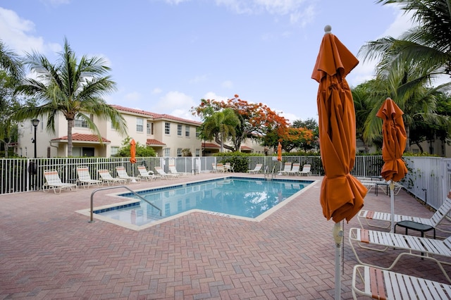 1020 E Longport Cir Unit A1, Delray Beach, FL 33444 - community pool featuring a patio area