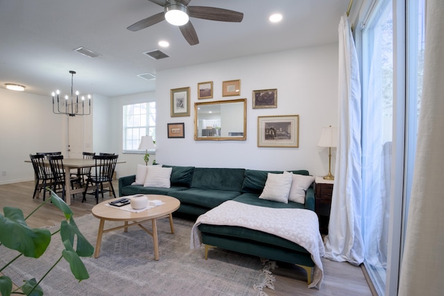1020 E Longport Cir Unit A1, Delray Beach, FL 33444 - living area featuring a chandelier, wood finished floors, a ceiling fan, recessed lighting, and baseboards