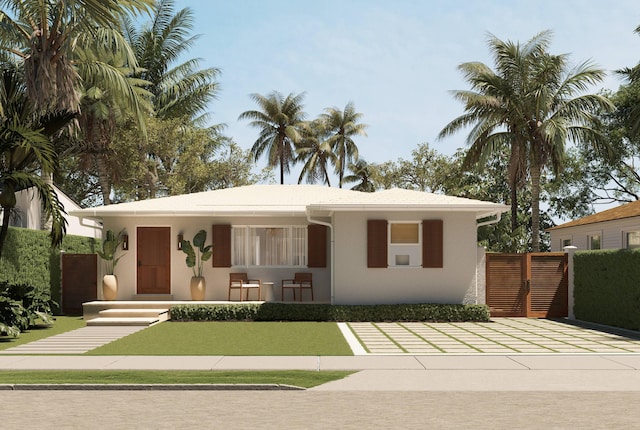 227 Greymon Dr, West Palm Beach, FL 33405 - view of front facade featuring stucco siding and a porch