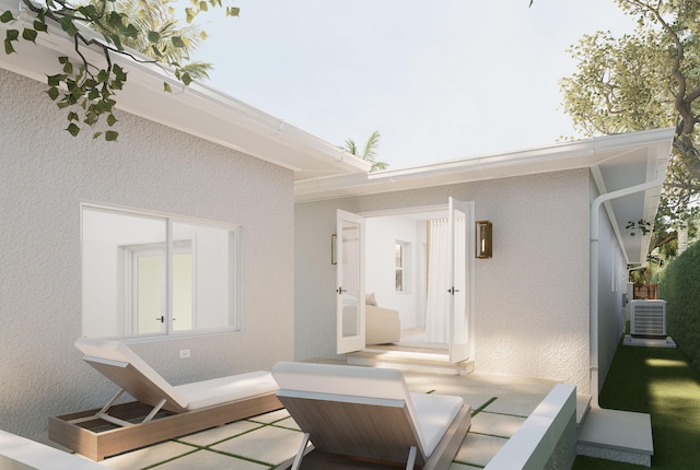 227 Greymon Dr, West Palm Beach, FL 33405 - back of property with stucco siding and cooling unit