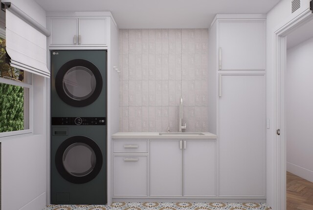 227 Greymon Dr, West Palm Beach, FL 33405 - washroom featuring estacked washer and dryer, cabinet space, and bar with sink