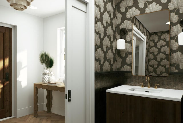 227 Greymon Dr, West Palm Beach, FL 33405 - bathroom featuring vanity, wallpapered walls, and baseboards