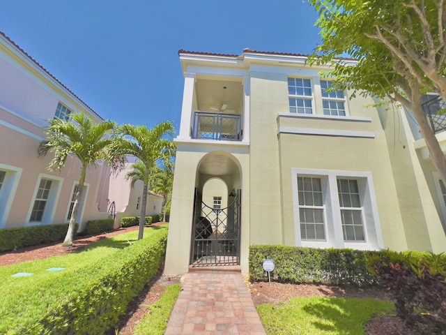 8300 NW 9th Ave, Boca Raton, FL 33487 - entrance to property featuring a balcony, stucco siding, and a tiled roof