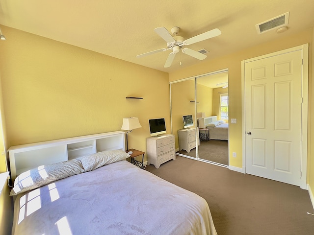 8300 NW 9th Ave, Boca Raton, FL 33487 - bedroom featuring dark carpet, a closet, ceiling fan, and baseboards