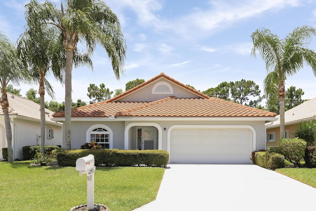 4393 SE Scotland Cay Way, Stuart, FL 34997 - mediterranean / spanish home with driveway, a garage, a front yard, and stucco siding
