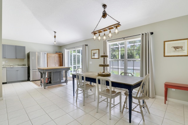 4393 SE Scotland Cay Way, Stuart, FL 34997 - dining room featuring baseboards and light tile patterned floors