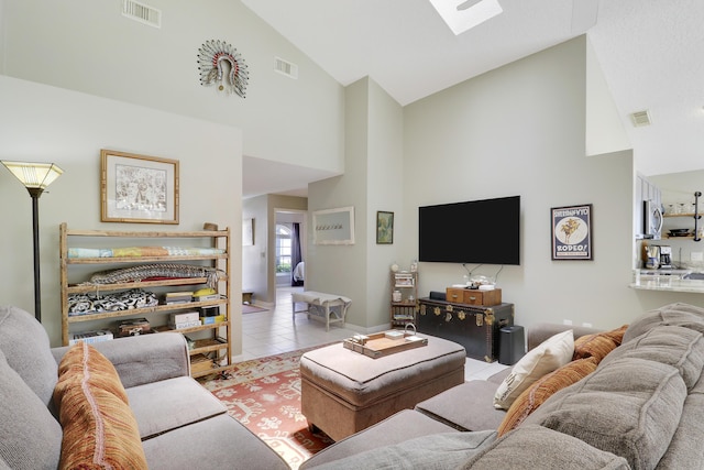 4393 SE Scotland Cay Way, Stuart, FL 34997 - living area featuring high vaulted ceiling, a skylight, and tile patterned flooring