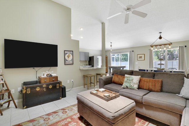 4393 SE Scotland Cay Way, Stuart, FL 34997 - living area with light tile patterned floors, ceiling fan, and high vaulted ceiling