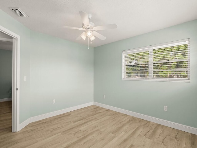 2800 Indian River Blvd Unit J6, Vero Beach, FL 32960 - unfurnished room featuring light wood-style floors and ceiling fan