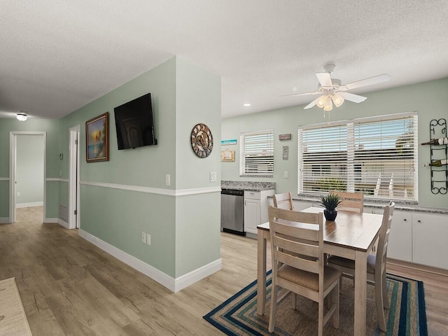 2800 Indian River Blvd Unit J6, Vero Beach, FL 32960 - dining space featuring ceiling fan, a textured ceiling, light wood-style flooring, and recessed lighting