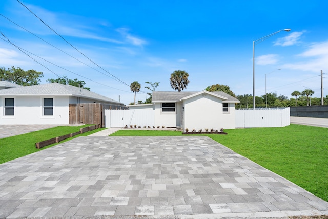 88 3rd St, West Palm Beach, FL 33413 - view of front of home featuring stucco siding and a patio