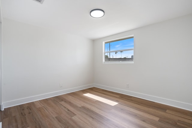 88 3rd St, West Palm Beach, FL 33413 - unfurnished room featuring wood finished floors and baseboards