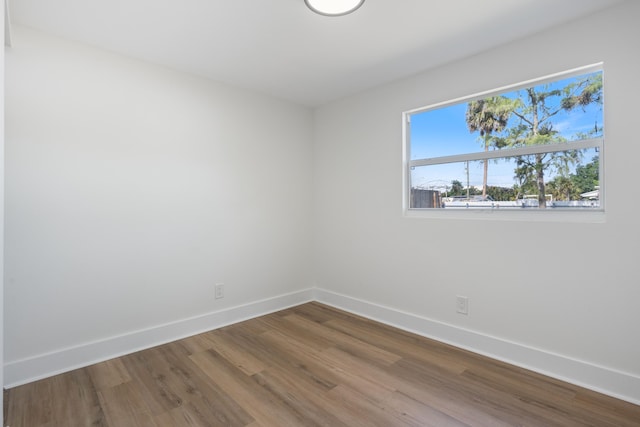 88 3rd St, West Palm Beach, FL 33413 - unfurnished room featuring wood finished floors and baseboards