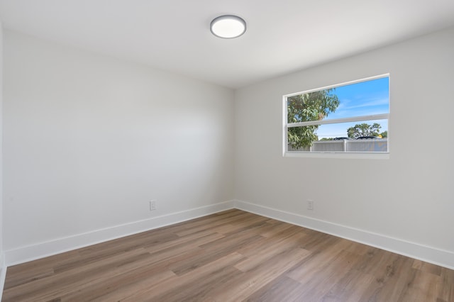 88 3rd St, West Palm Beach, FL 33413 - unfurnished room featuring wood finished floors and baseboards