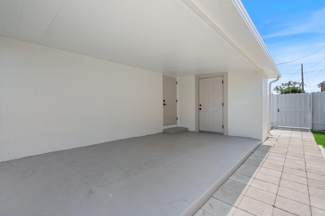 88 3rd St, West Palm Beach, FL 33413 - view of patio / terrace with a gate and a carport