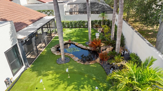 21415 Campo Allegro Dr, Boca Raton, FL 33433 - fenced backyard featuring a putting area and a small pond