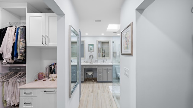 21415 Campo Allegro Dr, Boca Raton, FL 33433 - full bath with vanity, toilet, wood finished floors, recessed lighting, and a walk in closet