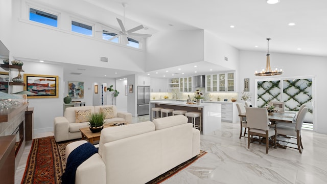 21415 Campo Allegro Dr, Boca Raton, FL 33433 - living room featuring high vaulted ceiling, a ceiling fan, recessed lighting, a chandelier, and light marble finish flooring