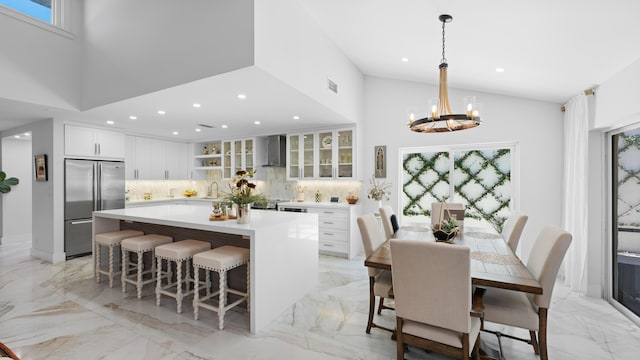 21415 Campo Allegro Dr, Boca Raton, FL 33433 - dining room with light marble finish flooring, high vaulted ceiling, a chandelier, recessed lighting, and healthy amount of natural light