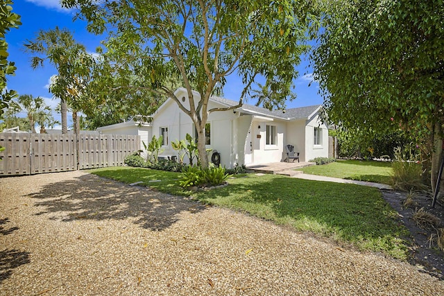 1630 N Ocean Breeze, Lake Worth Beach, FL 33460 - view of front of house with stucco siding and driveway