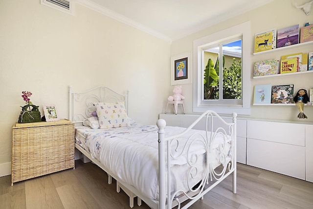 1630 N Ocean Breeze, Lake Worth Beach, FL 33460 - bedroom with ornamental molding and light wood-style floors