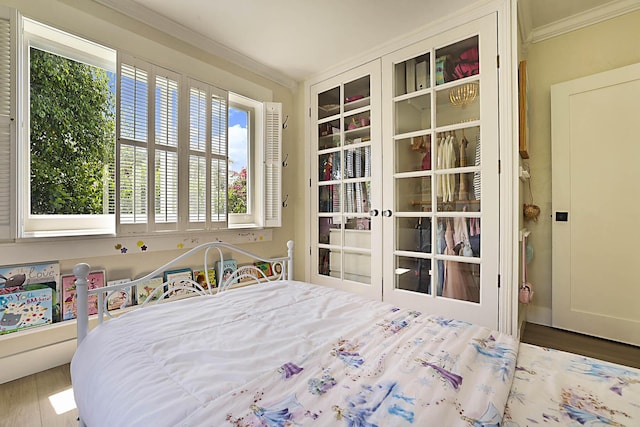 1630 N Ocean Breeze, Lake Worth Beach, FL 33460 - bedroom with crown molding, multiple windows, and wood finished floors