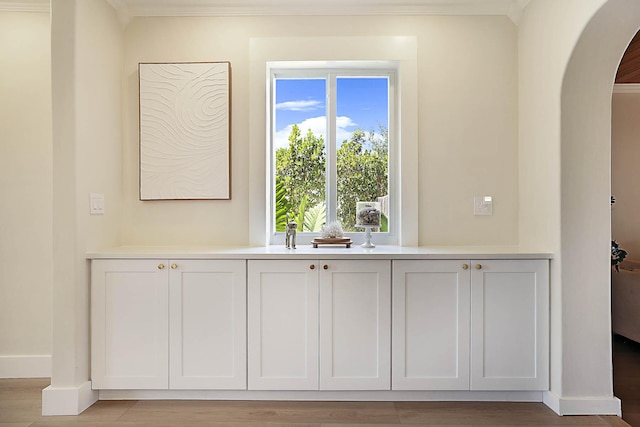 1630 N Ocean Breeze, Lake Worth Beach, FL 33460 - detailed view of arched walkways, crown molding, and wood finished floors