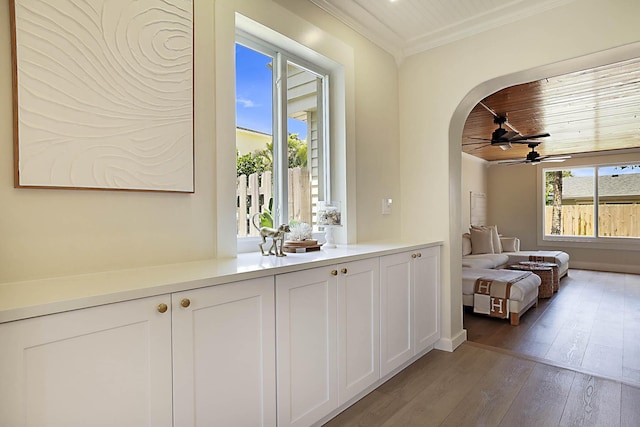 1630 N Ocean Breeze, Lake Worth Beach, FL 33460 - bar featuring ceiling fan, light wood-type flooring, wooden ceiling, arched walkways, and ornamental molding