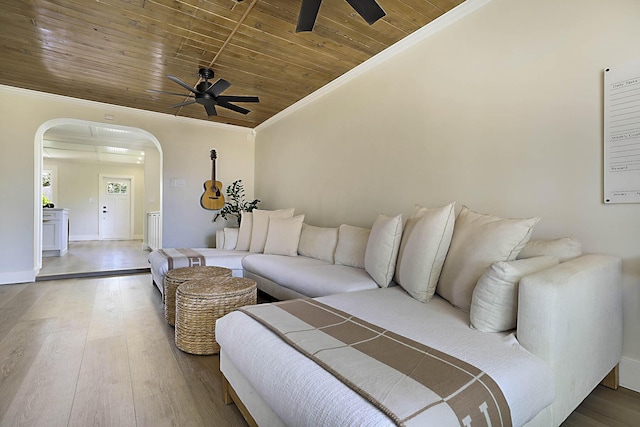 1630 N Ocean Breeze, Lake Worth Beach, FL 33460 - living area featuring a ceiling fan, arched walkways, wooden ceiling, crown molding, and wood finished floors
