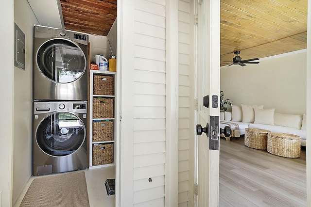 1630 N Ocean Breeze, Lake Worth Beach, FL 33460 - washroom with stacked washer / drying machine, wooden ceiling, a ceiling fan, electric panel, and wood finished floors