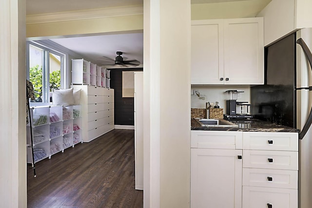 1630 N Ocean Breeze, Lake Worth Beach, FL 33460 - kitchen featuring ornamental molding, dark wood-style flooring, white cabinets, a ceiling fan, and freestanding refrigerator