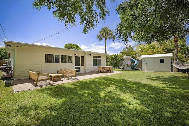 1630 N Ocean Breeze, Lake Worth Beach, FL 33460 - back of property with a patio, a yard, and a shed