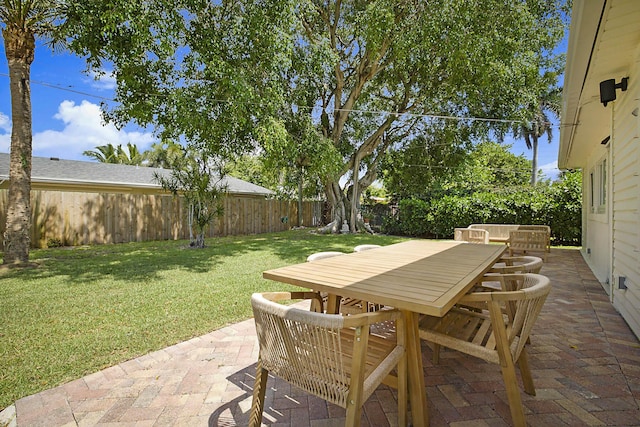 1630 N Ocean Breeze, Lake Worth Beach, FL 33460 - fenced backyard with outdoor dining space and a patio area