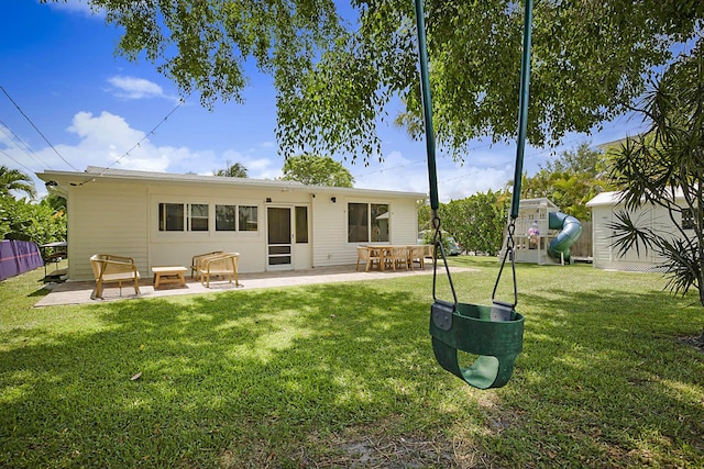 1630 N Ocean Breeze, Lake Worth Beach, FL 33460 - back of house with a patio and a yard