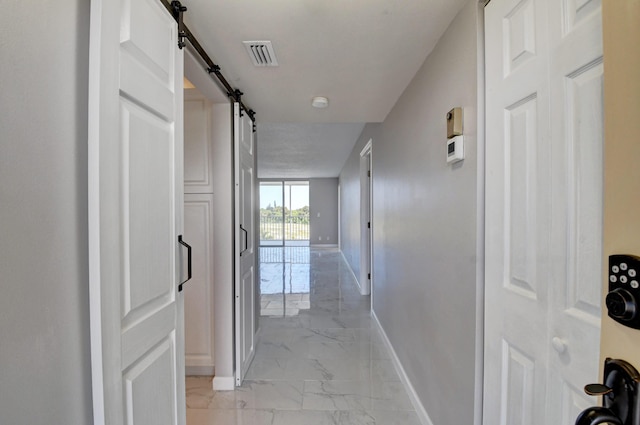 5500 NW 2nd Ave Three, Unit Three, Boca Raton, FL 33487 - corridor featuring baseboards, a barn door, and light marble finish flooring