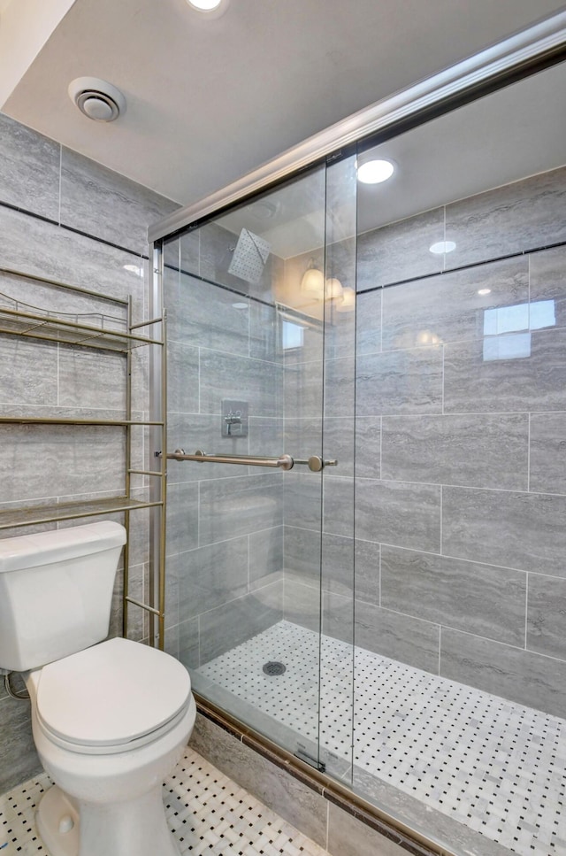 5500 NW 2nd Ave Three, Unit Three, Boca Raton, FL 33487 - full bathroom featuring a shower stall, toilet, and tile patterned floors