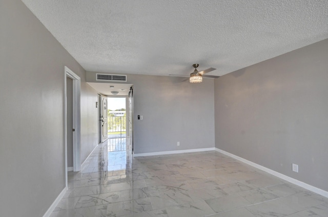 5500 NW 2nd Ave Three, Unit Three, Boca Raton, FL 33487 - spare room with light marble finish floors, a textured ceiling, ceiling fan, and baseboards