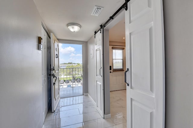 5500 NW 2nd Ave Three, Unit Three, Boca Raton, FL 33487 - doorway to outside with a barn door, baseboards, floor to ceiling windows, and light marble finish floors