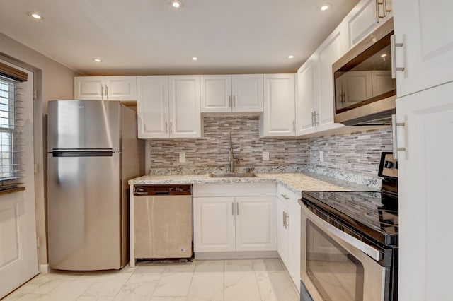 5500 NW 2nd Ave Three, Unit Three, Boca Raton, FL 33487 - kitchen with stainless steel appliances, a sink, light marble finish floors, white cabinetry, and recessed lighting