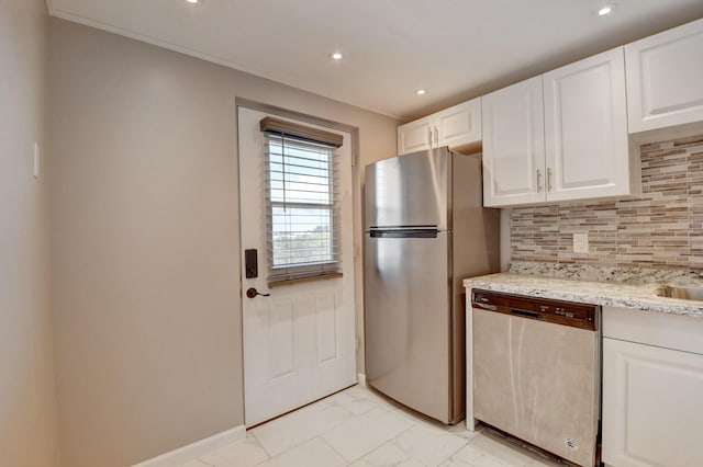 5500 NW 2nd Ave Three, Unit Three, Boca Raton, FL 33487 - kitchen with stainless steel appliances, tasteful backsplash, light marble finish flooring, recessed lighting, and white cabinets