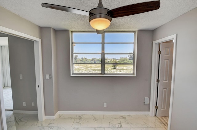 5500 NW 2nd Ave Three, Unit Three, Boca Raton, FL 33487 - empty room with light marble finish floors, a textured ceiling, and baseboards