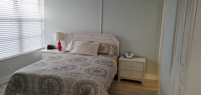 8 Royal Palm Way Unit 6040, Boca Raton, FL 33432 - bedroom featuring baseboards and wood finished floors