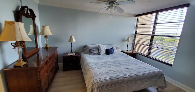 8 Royal Palm Way Unit 6040, Boca Raton, FL 33432 - bedroom with multiple windows, light wood finished floors, and ceiling fan