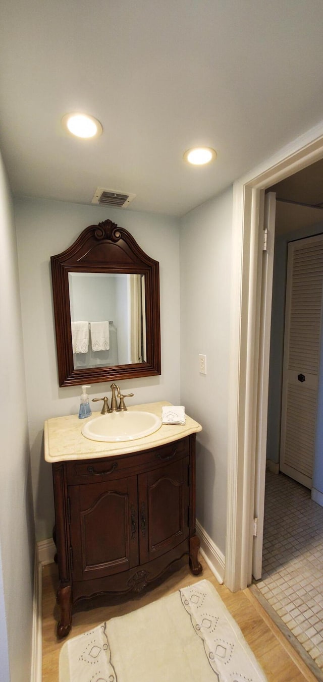 8 Royal Palm Way Unit 6040, Boca Raton, FL 33432 - bathroom featuring vanity, wood finished floors, and recessed lighting