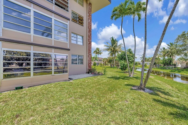 2901 NW 46th Ave Unit 101, Lauderdale Lakes, FL 33313 - view of grassy yard featuring a water view