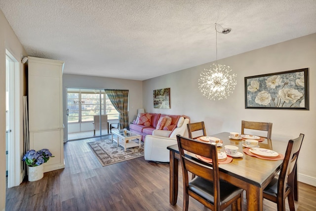 2901 NW 46th Ave Unit 101, Lauderdale Lakes, FL 33313 - dining room with dark wood finished floors, a textured ceiling, and a chandelier