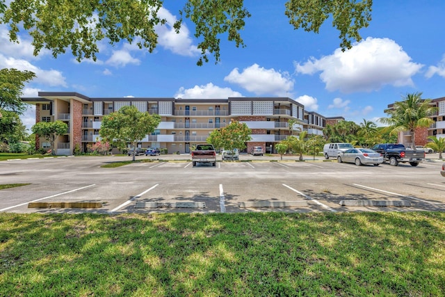 2901 NW 46th Ave Unit 101, Lauderdale Lakes, FL 33313 - view of apartment building / complex featuring uncovered parking