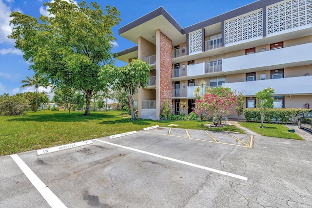 2901 NW 46th Ave Unit 101, Lauderdale Lakes, FL 33313 - view of apartment building / complex featuring uncovered parking