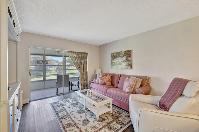 2901 NW 46th Ave Unit 101, Lauderdale Lakes, FL 33313 - living area with wood finished floors and a textured ceiling