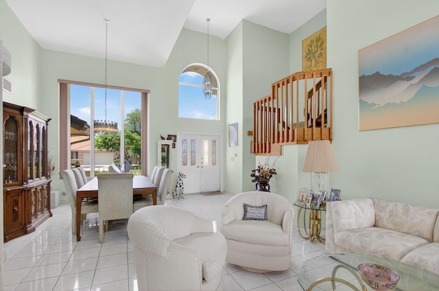 9645 Carousel Cir N, Boca Raton, FL 33434 - living room featuring high vaulted ceiling, light tile patterned flooring, and a chandelier